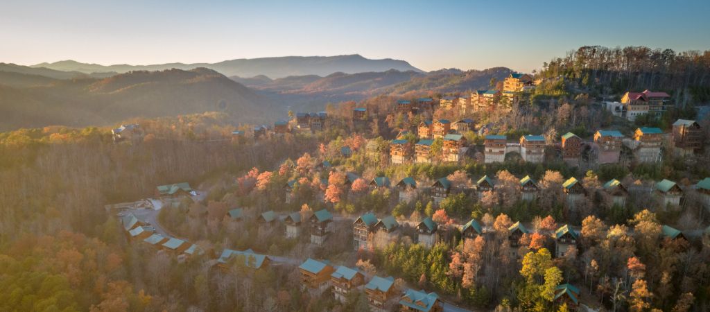 Smoky Mountain Cabin Resort Sunset A sunlit hill with a myriad of cabins in fall in the Great Smoky Mountains.